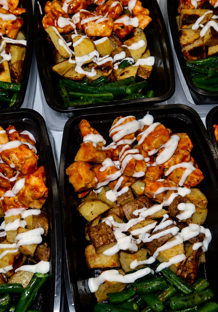 meal-prep-header-img Image of multiple prepared meals consisting of chicken, potatoes and green beans